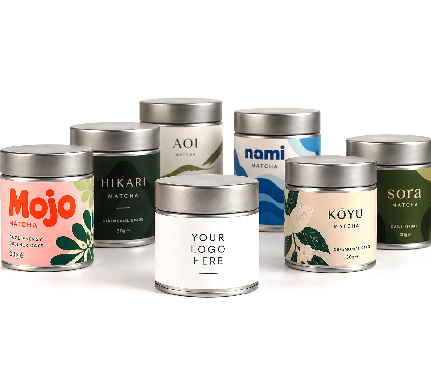 Seven custom-branded matcha tins, one labelled Your logo here