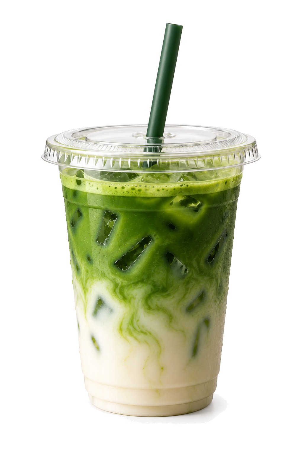 Iced matcha latte in a clear takeaway cup with ice, green matcha swirling through milk, a green straw and a white background